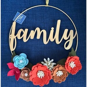 new w tags family wreath with beautiful felted flowers. C and F Home.